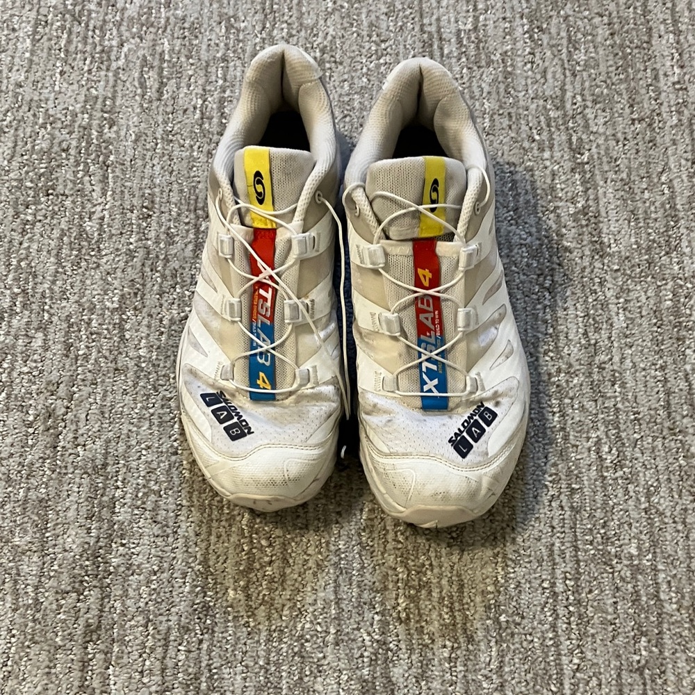 Salomon White Sneakers with Red, Blue, and Yellow Accents